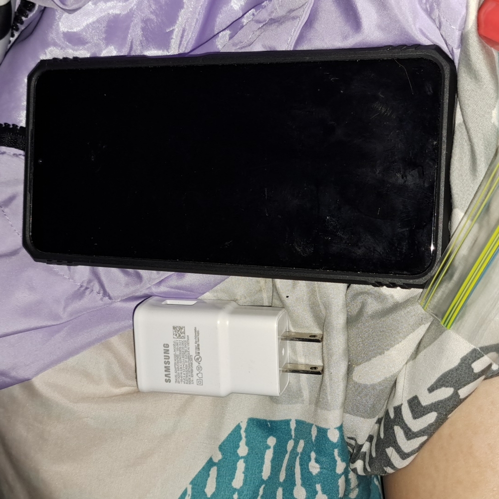 Samsung A12 phone with charging block